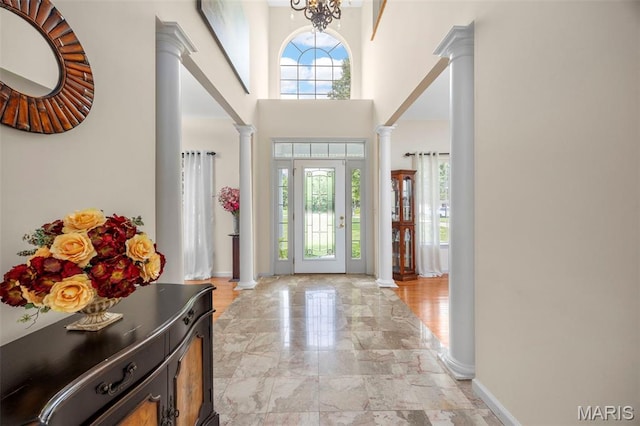 5 Hickory Glen Ct, Lake St Louis, MO 63367 - foyer featuring ornate columns, light marble finish flooring, and a towering ceiling