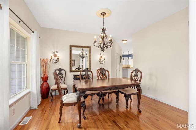 5 Hickory Glen Ct, Lake St Louis, MO 63367 - dining area featuring a chandelier and light wood-type flooring