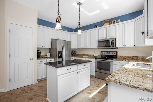 5 Hickory Glen Ct, Lake St Louis, MO 63367 - kitchen featuring appliances with stainless steel finishes, white cabinetry, a center island, and hanging light fixtures