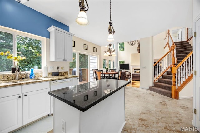 5 Hickory Glen Ct, Lake St Louis, MO 63367 - kitchen featuring decorative light fixtures, white cabinets, a chandelier, a kitchen island, and open floor plan