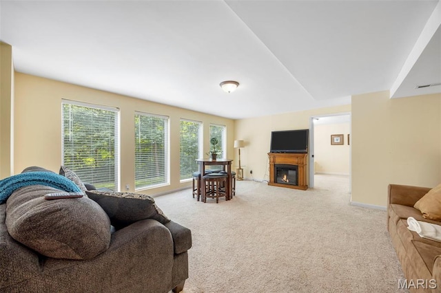 5 Hickory Glen Ct, Lake St Louis, MO 63367 - living area featuring a glass covered fireplace, plenty of natural light, and carpet floors
