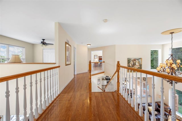 5 Hickory Glen Ct, Lake St Louis, MO 63367 - hall with an upstairs landing, wood finished floors, a chandelier, and healthy amount of natural light