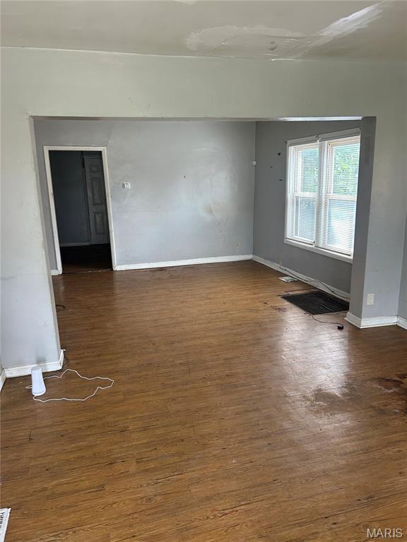 3442 Oakdale Ave, Saint Louis, MO 63121 - spare room featuring wood finished floors