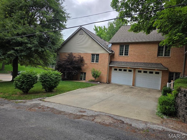 302 Lorean St, Troy, IL 62294 - view of front facade featuring brick siding, driveway, a garage, and a front lawn