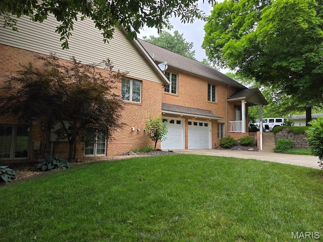 302 Lorean St, Troy, IL 62294 - view of side of home with a garage, driveway, a lawn, and brick siding