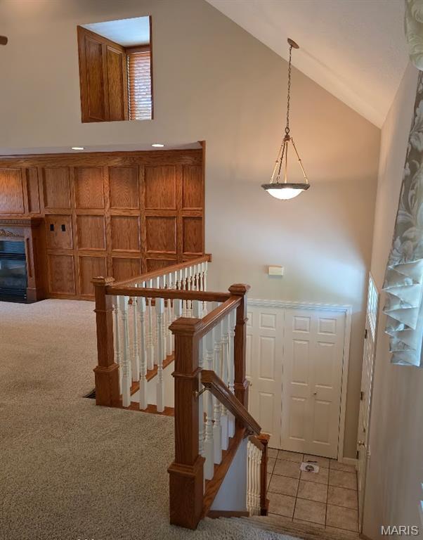 302 Lorean St, Troy, IL 62294 - stairs with carpet and high vaulted ceiling