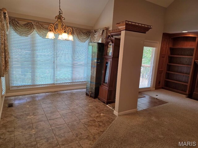 302 Lorean St, Troy, IL 62294 - unfurnished dining area with a chandelier, lofted ceiling, and tile patterned floors