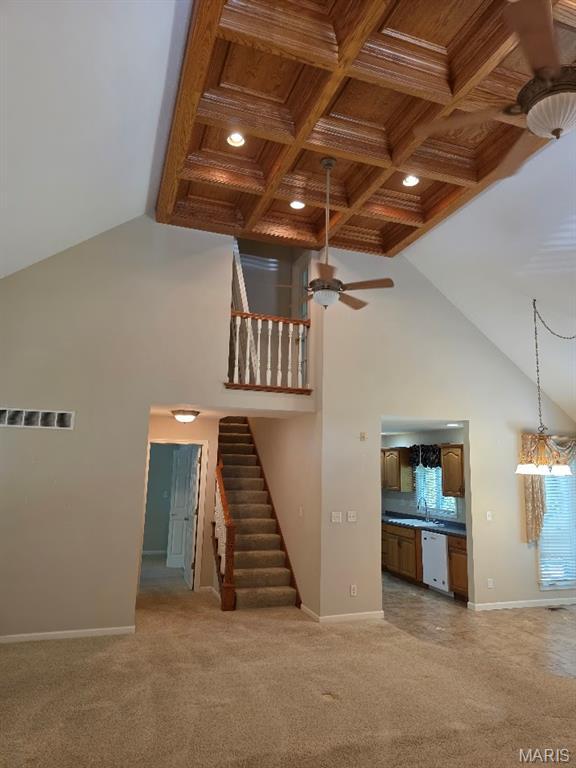302 Lorean St, Troy, IL 62294 - stairs with ceiling fan, high vaulted ceiling, recessed lighting, carpet, and a wood ceiling with exposed beams