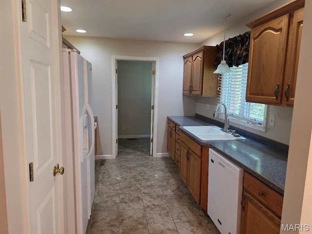 302 Lorean St, Troy, IL 62294 - kitchen featuring white appliances, dark countertops, pendant lighting, brown cabinetry, and recessed lighting