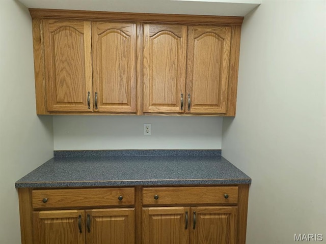 302 Lorean St, Troy, IL 62294 - kitchen with dark countertops and brown cabinets
