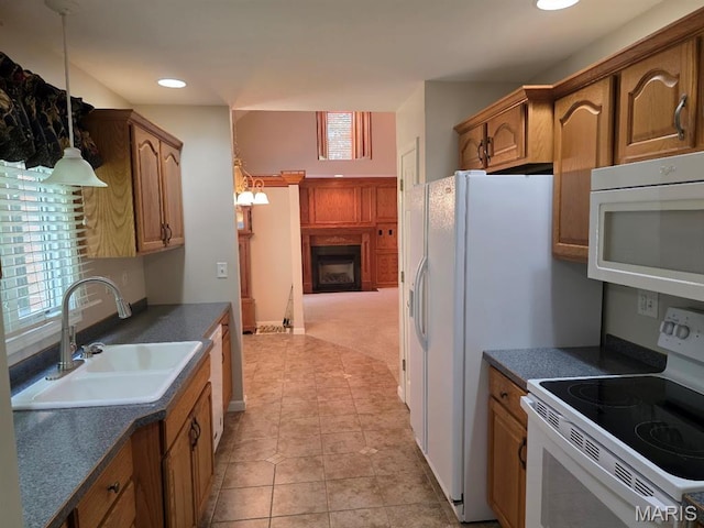 302 Lorean St, Troy, IL 62294 - kitchen featuring white appliances, dark countertops, plenty of natural light, and recessed lighting