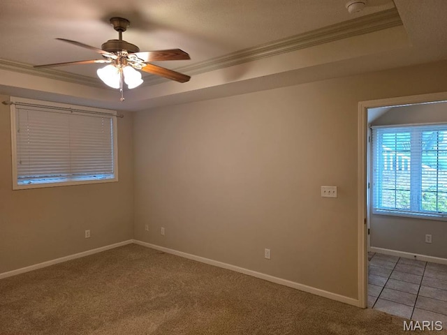 302 Lorean St, Troy, IL 62294 - spare room with crown molding, a tray ceiling, a ceiling fan, a smoke detector, and light colored carpet