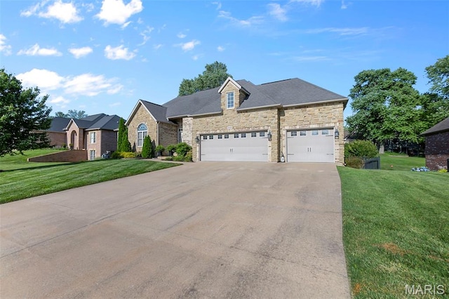 2528 Palomino Dr, Cape Girardeau, MO 63701 - view of front of home with concrete driveway, a front yard, stone siding, and a garage