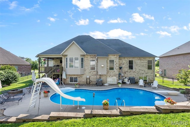 2528 Palomino Dr, Cape Girardeau, MO 63701 - view of swimming pool featuring a water slide, a diving board, a fire pit, a patio, and stairs