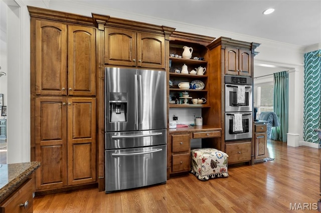 2528 Palomino Dr, Cape Girardeau, MO 63701 - kitchen with stainless steel appliances, open shelves, light wood finished floors, dark stone countertops, and ornamental molding