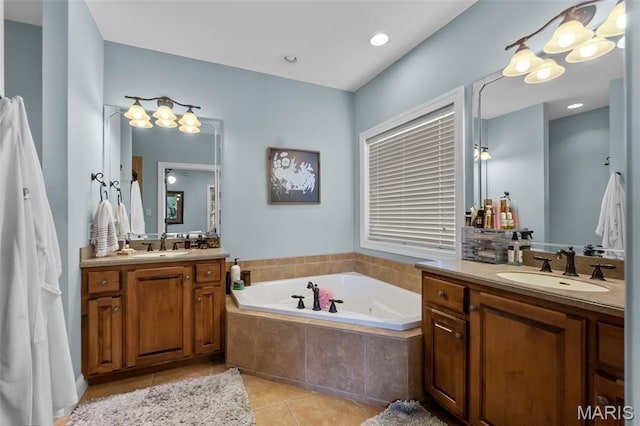 2528 Palomino Dr, Cape Girardeau, MO 63701 - bathroom with tile patterned flooring, two vanities, and a bath