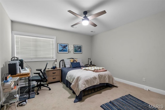 2528 Palomino Dr, Cape Girardeau, MO 63701 - bedroom with light colored carpet, a desk, and a ceiling fan