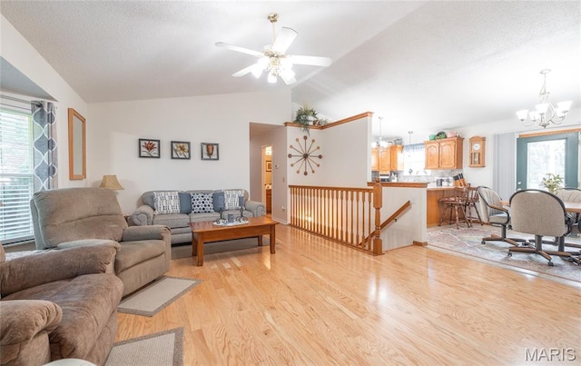 240 N Bernhardt Ave, Gerald, MO 63037 - living room with a chandelier, lofted ceiling, light wood-type flooring, and a ceiling fan