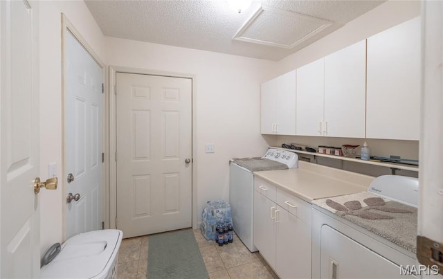 240 N Bernhardt Ave, Gerald, MO 63037 - laundry room featuring washing machine and dryer, cabinet space, and light tile patterned floors