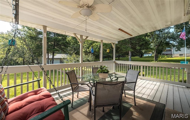240 N Bernhardt Ave, Gerald, MO 63037 - wooden deck featuring a ceiling fan, a lawn, and outdoor dining space