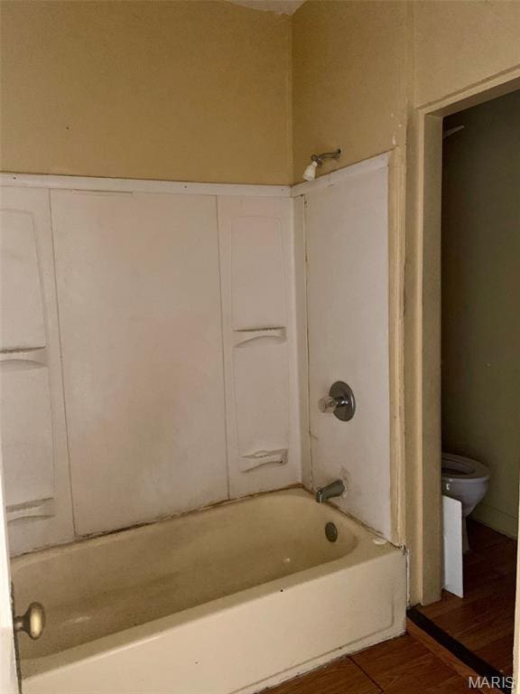 5811 Helen Ave, Jennings, MO 63136 - bathroom featuring wood finished floors and washtub / shower combination