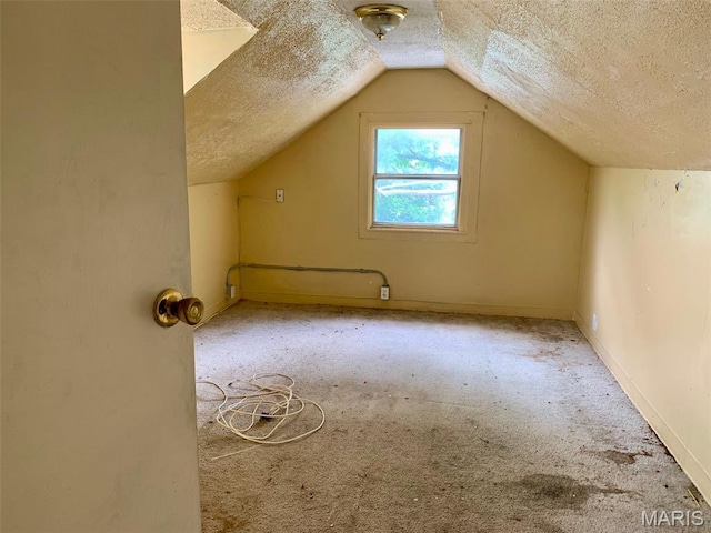 5811 Helen Ave, Jennings, MO 63136 - additional living space with a textured ceiling, lofted ceiling, and carpet flooring