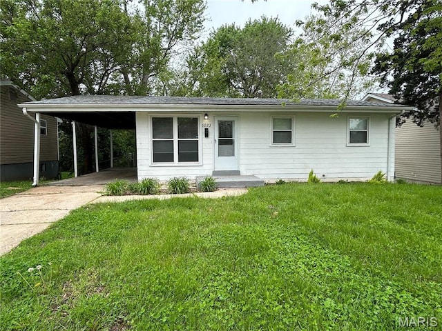 6023 Shillington Dr, Berkeley, MO 63134 - view of front of house with driveway, a front yard, and an attached carport