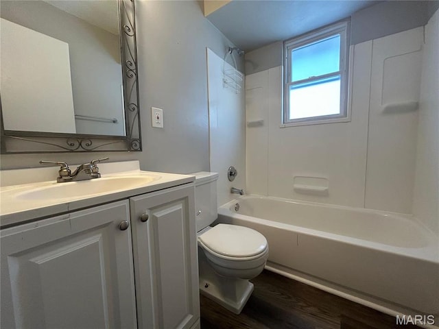 6023 Shillington Dr, Berkeley, MO 63134 - bathroom featuring wood finished floors, vanity, and  shower combination
