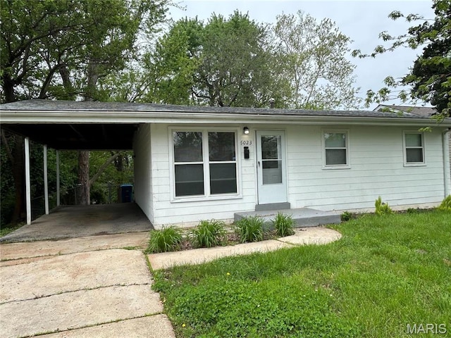 6023 Shillington Dr, Berkeley, MO 63134 - ranch-style house with driveway, a carport, and a front yard