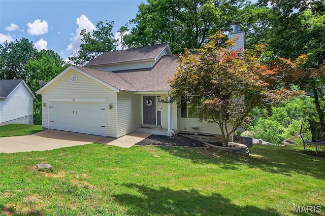 794 Buckboard Ln, Fenton, MO 63026 - view of front of home featuring a trampoline, a garage, driveway, a front lawn, and roof with shingles