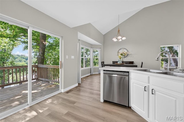 794 Buckboard Ln, Fenton, MO 63026 - kitchen with dishwasher, white cabinets, light wood finished floors, a chandelier, and pendant lighting