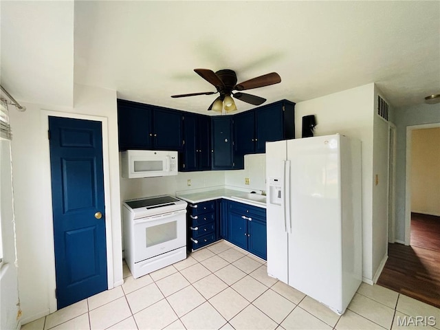628 Valley View Dr, Bethalto, IL 62010 - kitchen with white appliances, blue cabinetry, light tile patterned floors, a ceiling fan, and light countertops