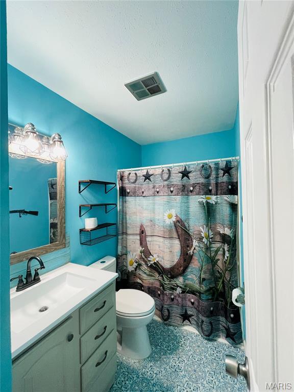 628 Valley View Dr, Bethalto, IL 62010 - full bathroom with vanity and a shower with shower curtain