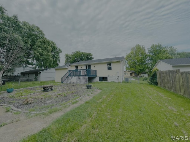 628 Valley View Dr, Bethalto, IL 62010 - rear view of house featuring an outdoor fire pit, a deck, and a fenced backyard
