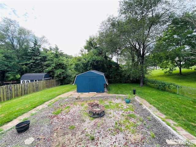 628 Valley View Dr, Bethalto, IL 62010 - view of yard with a storage shed and a fire pit