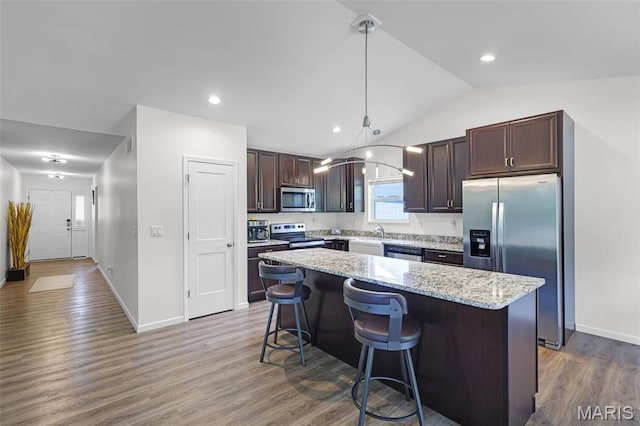 1007 Crows Nest Ct, Caseyville, IL 62232 - kitchen with appliances with stainless steel finishes, dark brown cabinets, lofted ceiling, a center island, and wood finished floors