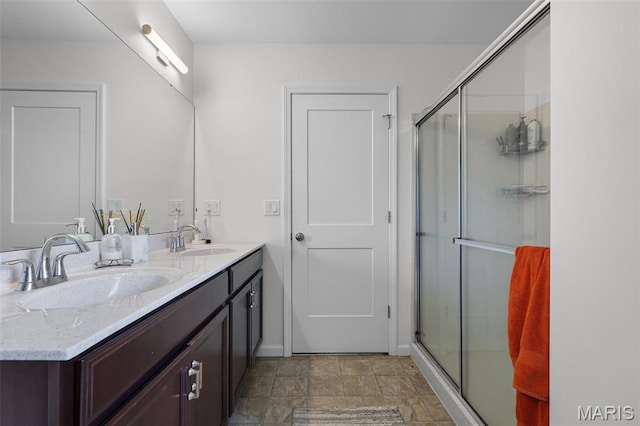 1007 Crows Nest Ct, Caseyville, IL 62232 - bathroom with double vanity, an enclosed shower, and stone finish flooring