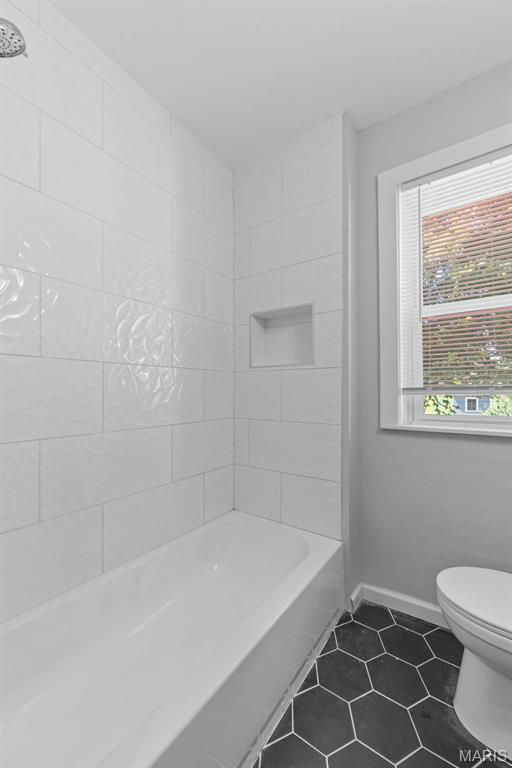 8260 Glen Echo Dr, Bel-Nor, MO 63121 - bathroom with tile patterned flooring and bathing tub / shower combination