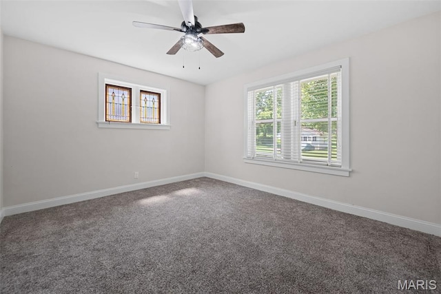 8260 Glen Echo Dr, Bel-Nor, MO 63121 - empty room featuring plenty of natural light, a ceiling fan, and carpet