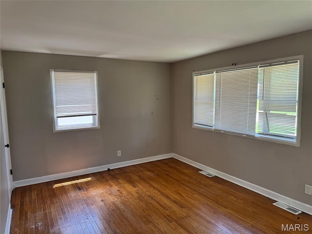 11880 Criterion Ave, Saint Louis, MO 63138 - empty room with hardwood / wood-style floors and baseboards