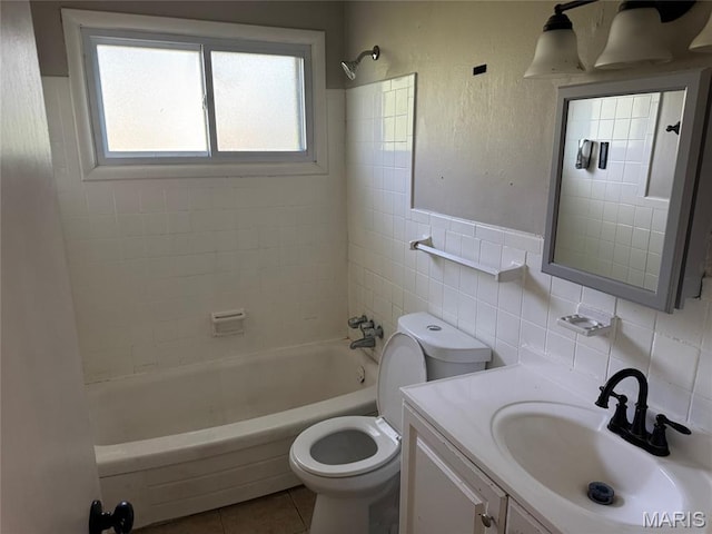 11880 Criterion Ave, Saint Louis, MO 63138 - bathroom featuring tile walls, vanity, tile patterned flooring, and washtub / shower combination
