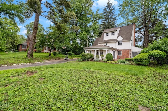1931 Elm St, Saint Charles, MO 63301 - view of front of house featuring a front lawn and brick siding