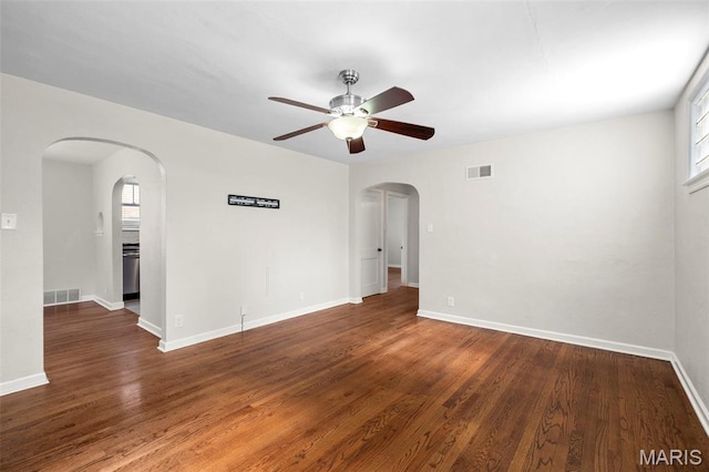 6915 Wise Ave, Saint Louis, MO 63139 - unfurnished room with ceiling fan, arched walkways, and wood finished floors