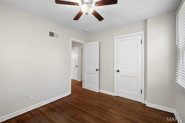 6915 Wise Ave, Saint Louis, MO 63139 - unfurnished bedroom with wood finished floors and ceiling fan