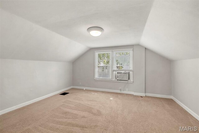6915 Wise Ave, Saint Louis, MO 63139 - additional living space with cooling unit, lofted ceiling, and carpet