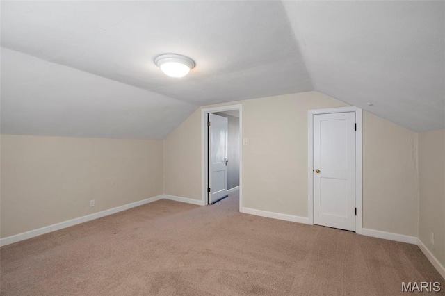 6915 Wise Ave, Saint Louis, MO 63139 - additional living space featuring light carpet and vaulted ceiling