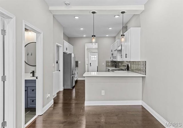 4355 Hunt Ave, Saint Louis, MO 63110 - kitchen with freestanding refrigerator, dark wood-style floors, white cabinetry, and recessed lighting