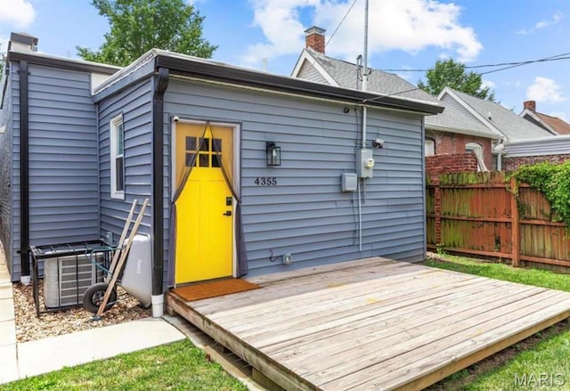 4355 Hunt Ave, Saint Louis, MO 63110 - rear view of house featuring a wooden deck and a chimney