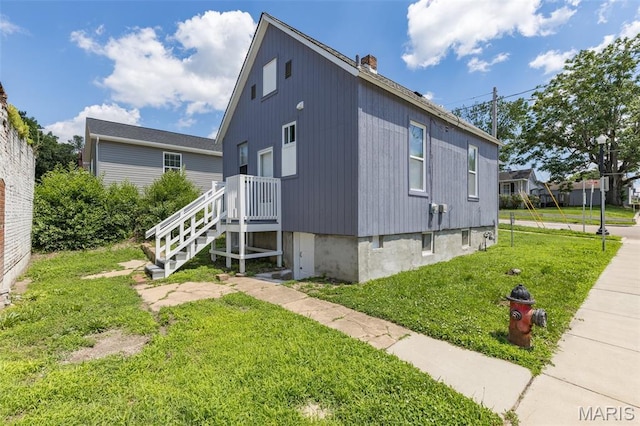 229 Broadway Ave, Crystal City, MO 63019 - view of property exterior with a lawn and a chimney