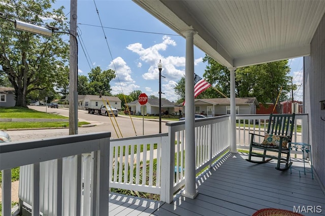 229 Broadway Ave, Crystal City, MO 63019 - wooden porch featuring a residential view